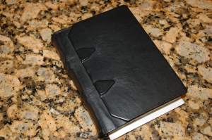 leather-bound blank book devoted to Dark Apostle notes
